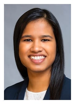 Dr. Radhika Pillai, MD, FAAP, with long dark hair, is smiling at the camera wearing a dark blazer and white top against a neutral gray background. Dr. Radhika Pillai, MD, FAAP, with long dark hair, is smiling at the camera wearing a dark blazer and white top against a neutral gray background.